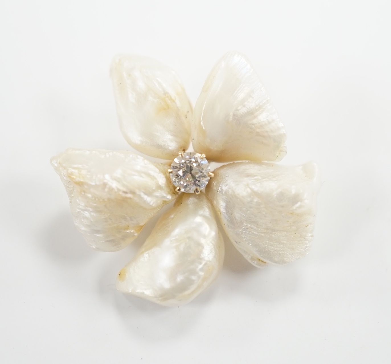 A yellow metal mounted baroque pearl and single stone diamond set flower head brooch, 30mm, gross weight 9.1 grams.